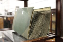 A large early 20th century postcard album and contents