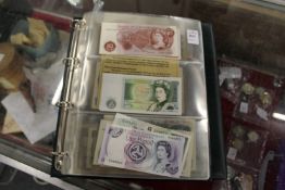 A folder containing numerous world bank notes