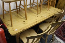A Victorian style pine kitchen table on turned legs