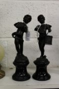 A pair of small bronze and marble figures of musical cherubs