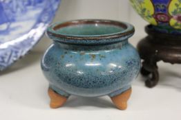 A small torquoise glazed triped senser