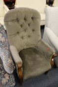A Victorian button upholstered armchair
