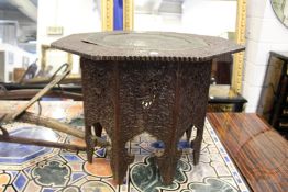 A good 19th century Eastern carved hardwood and brass tray top octagonal shaped folding table