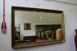 A gilt framed mirror