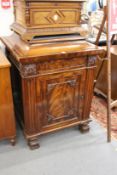 A good 19th century mahogany pedestal cupboard with carved decoration