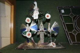An unusual glass ornamental item depicting exotic birds