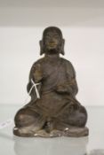 A bronze figure of a seated Buddha possible 19th century