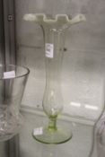 A Vaseline glass frilly edged vase