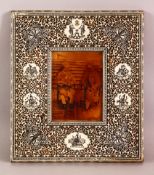 A 19TH CENTURY INDIAN CARVED AND PIERCED IVORY AND SANDALWOOD FRAME, with pen work decoration,