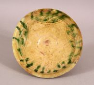 A FINE 12TH/13TH CENTURY PERSIAN SELJUK POTTERY DISH, 13cm diameter.