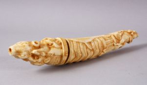 A 19TH CENTURY INDIAN MUGHAL CARVED IVORY POWDER FLASK, carved with scenes of animals, including a