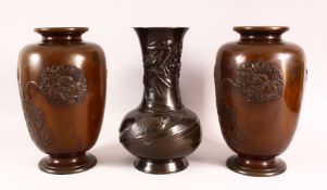 A PAIR OF JAPANESE MEIJI PERIOD BRONZE VASES, with relief geranium decoration, 31cm high, together