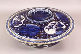 A LARGE 19TH CENTURY CHINESE BLUE & WHITE PORCELAIN BOWL & COVER - decorated with panel scenes off