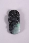 A CHINESE CARVED GREY JADEITE PENDANT, carved as a male figure, 8cm x 4cm.