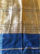 A GILT DECORATED BLUE COTTON INDIAN TISSUE, Circa 1920, 11ft 8in x 1ft 8in.