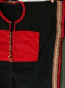 AN UNUSUAL ETHNIC JACKET, 20th Century, possibly Chinese minority people, red embroidered on a black