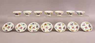 A SET OF SEVEN 19TH CENTURY CHINIESE FAMILLE ROSE PORCELAIN TEA BOWLS & SAUCERS - each decorated