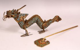 A CHINSE GILT METAL MODEL OF A DRAGON, inset with turquoise and coral, together with an enamel