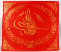 A TURKISH PAINTED CALLIGRAPHY PANEL, red and gilt calligraphy, 50cm x 57cm