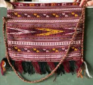 A TEKKE EMBROIDERY MADE INTO A SHOULDER BAG, together with three further shoulder bags made from