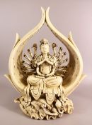 A LARGE CHINESE DEHUA PORCELAIN FIGURE OF MULTI ARM GODDESS - GUANYIN - seated upon lotus with multi