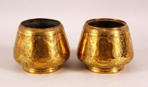A PAIR OF 19TH CENTURY PERSIAN QAJAR ENGRAVED BRASS BOWLS, 11cm diameter.