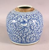 A CHINESE BLUE & WHITE PORCELAIN GINGER JAR - decorated with scrolling floral decoration, 20cm high