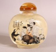 A CHINESE REVERSE PAINTED SNUFF BOTTLE - decorated with figures and moneys in landscapes - with
