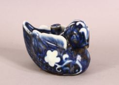 A CHINESE BLUE AND WHITE WATER DROPPER in the form of a bird, 10cm long.