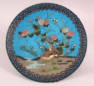 A JAPANESE CLOISONNE CIRCULAR DISH, decorated with quails by a stream, 30cm diameter.