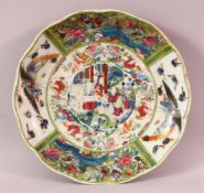 A CHINESE FAMILLE ROSE CANTON STYLE PORCELAIN DISH, decorated with panels of flora and birds and a