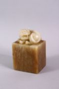 A GOOD CHINESE SOAPSTONE CARVING in the form of a dog of fo, 8cm high.
