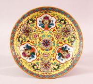 A CHINESE FAMILLE JAUNE YELLOW GROUND PORCELAIN PLATE - decorated with panels of objects and