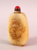 A CHINESE CARVED WHITE JADE SNUFF BOTTLE, carved with a dragon and horses, 8.5cm high