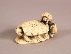 A JAPANESE MEIJI PERIOD CARVED IVORY NETSUKE in the form of a turtle upon a lily pad with two
