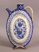 A BLUE & WHITE IZNIK POTTERY WATER URN - decorated with floral decoration - 26.5cm ( handle af)