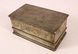 A CHINESE PEWTER CARVED DRAGON LIDDED BOX - The lid incised with a dragon, the sides with
