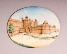 AN INDIAN MINIATURE PAINTED OVAL depicting a fort, unframed, 6.5cm x 5cm.