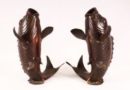A MIRRORED PAIR OF JAPANESE MEIJI PERIOD BRONZE CARP FORMED VASES, 29cm high.