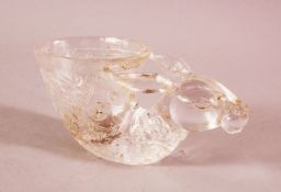 A CHINESE CARVED MOULDED GLASS LIBATION CUP- with a deer head and archaic design, 15cm