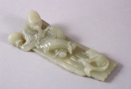 A CHINESE CARVED CELADON JADE FIGURE OF A RECLINED IMMORTAL & FISH, the immortal figure reclined