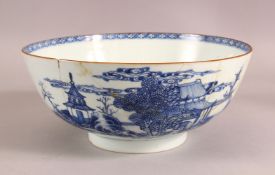 A CHINESE BLUE AND WHITE CIRCULAR BOWL, the outer painted with a landscape setting and temples, (
