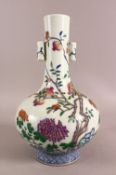 A CHINESE DOUCAI DECORATED PORCELAIN FRUIT VASE - with twin handles, decorated with native flowers