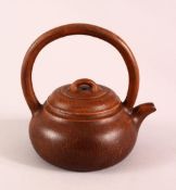 A CHINESE YIXING CLAY TEAPOT, with a fixed moulded handle, the base with a da bin mark, 16cm high.
