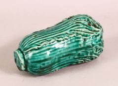 A CHINESE TURQUOISE GLAZED FRUIT FORMED PORCELAIN WATER DROPPER - in the form of a fruit or
