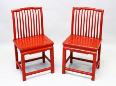 A PAIR OF CHINESE RED LACQUER STICK BACK SIDE CHAIRS, with panelled solid seats and stretchered