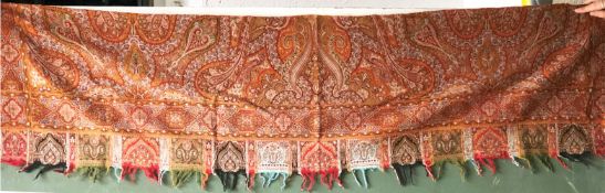 A SMALL EUROPEAN PAISLEY FRAGMENT, with fringe and typical embroidered design, circa 1860,