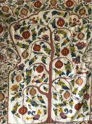 A GOOD UZBEK SUSANI HAND EMBROIDERED ETHNIC TEXTILE, the centre embroidered with a pomegranate