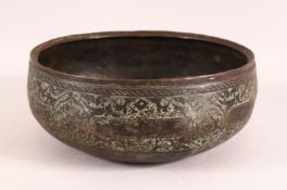 A 16TH CENTURY PERSIAN EARLY SAFAVID ENGRAVED BRONZE BOWL, 23cm diameter.