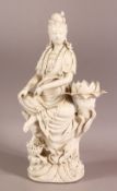 A GOOD CHINESE BLANC DE CHINE PORCELAIN FIGURE OF GUANYIN, in a seated pose upon lotus, holding a